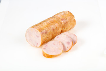 Tasty meat sausages over white background