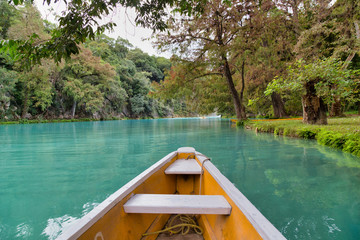Fototapeta premium (EL SALTO-EL MECO) san luis potosi México, hermosa cascada Turquoise water in a river and cliffs of the reserve. Beautiful natural canyon, blue river water and boating