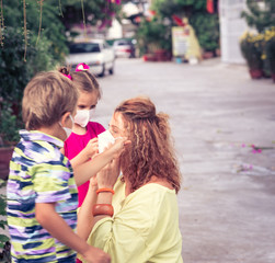 Family wearing facial disposable mask. Coronavirus protection