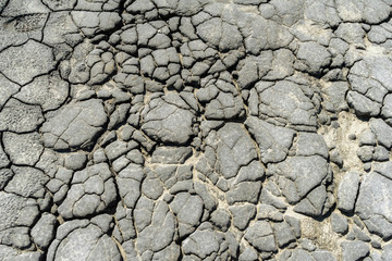 Cracked soil in Berca Muddy Volcanoes area in Buzau, Romania; active muddy volcanoes