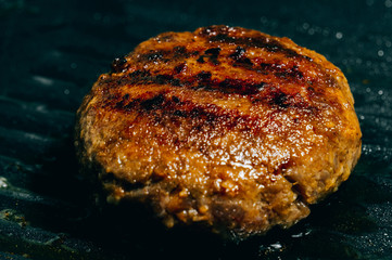 Hamburg meat grilling in a pan One of the main ingredients of a hamburger.