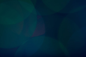 Green and blue colored abstract bokeh lights background