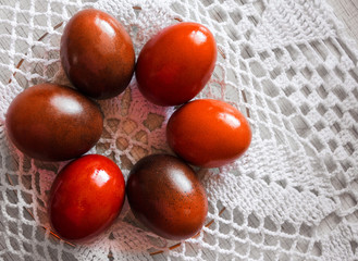 Colored eggs lie on a napkin.