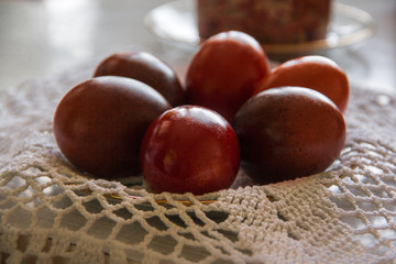 Colored eggs lie on a napkin.
