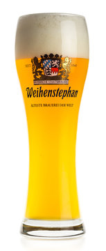 Glass of german Weihenstephaner wheat beer isolated on white