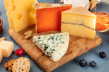 Cheese board. Blue cheese, red Leicester, Dutch cheese and others