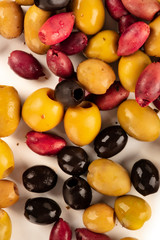 Olives variety background texture. Many black, green and red olives, shot from the top