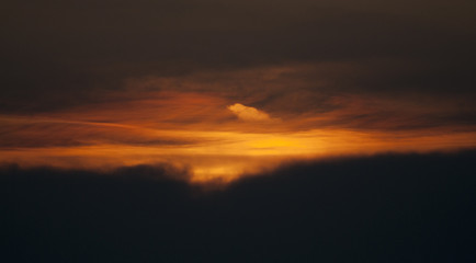 Orange Sunset With Dark Clouds Over