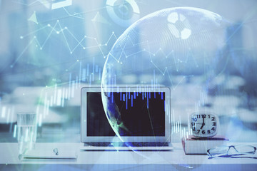 Forex Chart hologram on table with computer background. Multi exposure. Concept of financial...