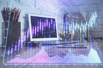 Double exposure of forex chart and work space with computer. Concept of international online trading.