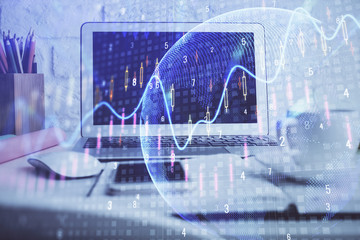 Financial graph colorful drawing and table with computer on background. Double exposure. Concept of...