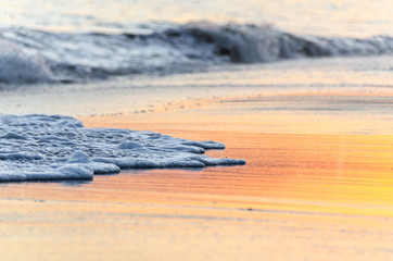 Fototapeta na wymiar Sunset on the beach of Our Lady of Rocha in Lagoa, Algarve, Portugal.