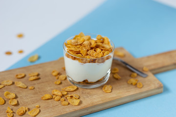Yogurt bowl with cornflakes. Healthy snack, healthy breakfast