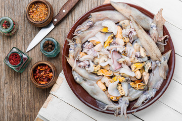 Raw seafood on a wooden board