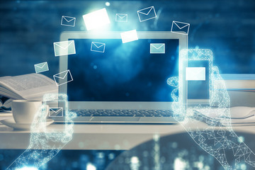 Desktop computer background in office and flying envelops hologram drawing. Multi exposure. Electronic mail concept.