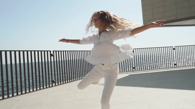 Preteen girl whirl around, making graceful dancing performance