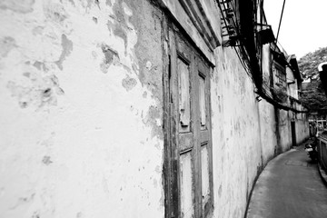 Windows and walls of old residences in Bangkok's Talat Noi area,Black and White