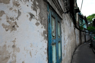 Windows and walls of old residences in Bangkok's Talat Noi area