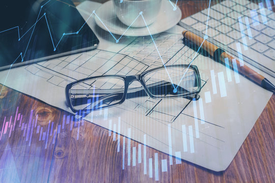 Financial chart hologram with glasses on the table background. Concept of business. Double exposure. - Powered by Adobe