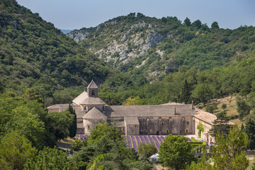 View from the road above the Abbaye de Senanque, famous for it's fields of lavender and located...