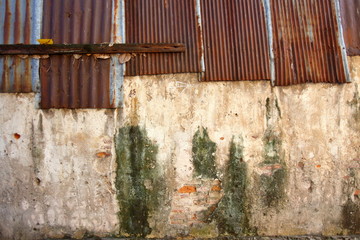 An old wall of many decades With various traces that have deteriorated Occurred on this wall