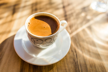 Turkish coffee on a wooden cafe table