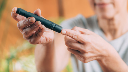 Blood Sugar Finger Prick Testing with Portable Glucometer