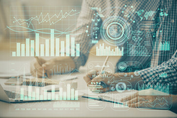 Multi exposure of forex chart with man working on computer on background. Concept of market analysis.