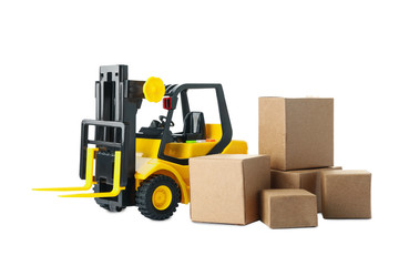 Toy forklift with boxes isolated on white. Logistics and wholesale concept