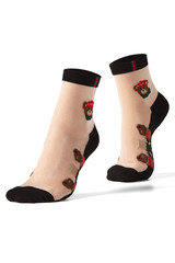 Cropped shot of female feet on tiptoe in flesh-colored nylon sheer socks with embroidered teddy-bears, black toes, bottoms and rims. The photo is made on the white background.  
