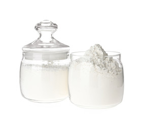 Organic flour in glass jars isolated on white
