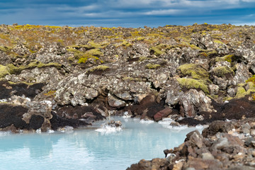 Fototapeta premium Beautiful geothermisch area in Reykjavik, Iceland, with mountain in the background