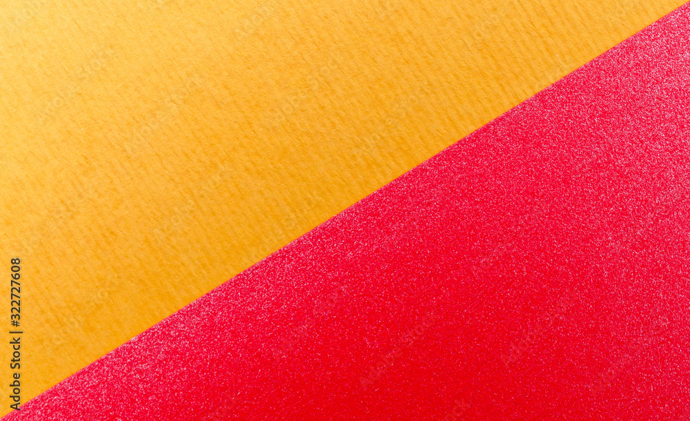 Wall mural Yellow and red paper texture background. Place for text. Two tones. Background for presentation.