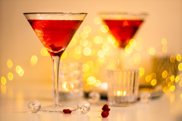 Classic red cocktail in fancy texture glass on bright light bokeh background