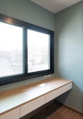 Fototapeta premium Window with blue pastel wall. Interior design