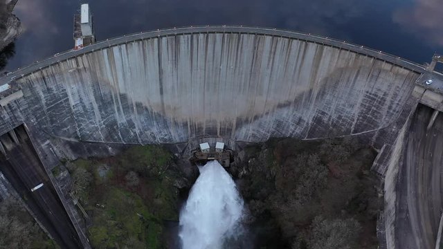 Overhead Aerial Water Flowing Through Spanish Dam