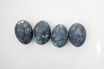 Background with easter eggs. Naturally dyed eggs prepared for Easter on white background. Happy Easter card. 