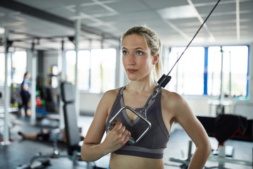 Woman in fitness center at train station