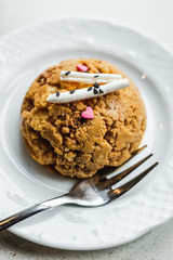 Traditional russian soviet cake muraveynik or funnel cake on a white plate, a dessert fork