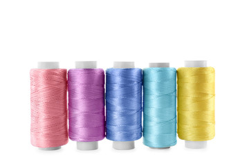 Set of color sewing threads isolated on white