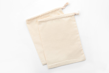 Cotton eco bags isolated on white, top view