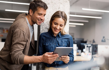 Business people having fun and chatting at workplace office