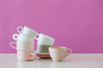 modern cups on white table on background pink wall