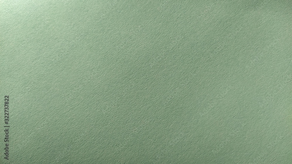 Aufkleber a sheet of light green paper with vignetting at the bottom. calm green with fine paper texture. soot