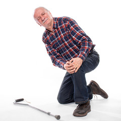  Senior man suffering from knee pain over white background