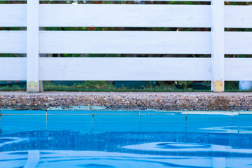 soft focus concept swimming pool side water surface and garden white wooden deck wall background object outside space for copy or your text here