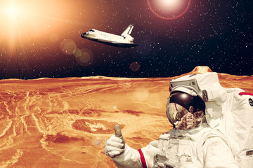 Space mission. Astronaut and rocky landscape. The elements of this image furnished by NASA.