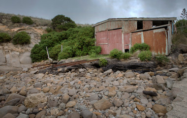 Historic boathouse with railtracks Matakaea Reserve Coast near Palmerston New Zealand