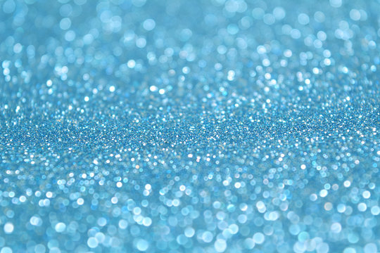 Baby blue glitter background. Selective focus. Beautiful sparkle  abstraction. Glamour Bokeh Effect. For party, holidays, celebration. Stock  Photo