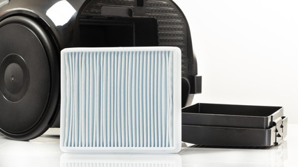 New white square dust filter for vacuum cleaner.